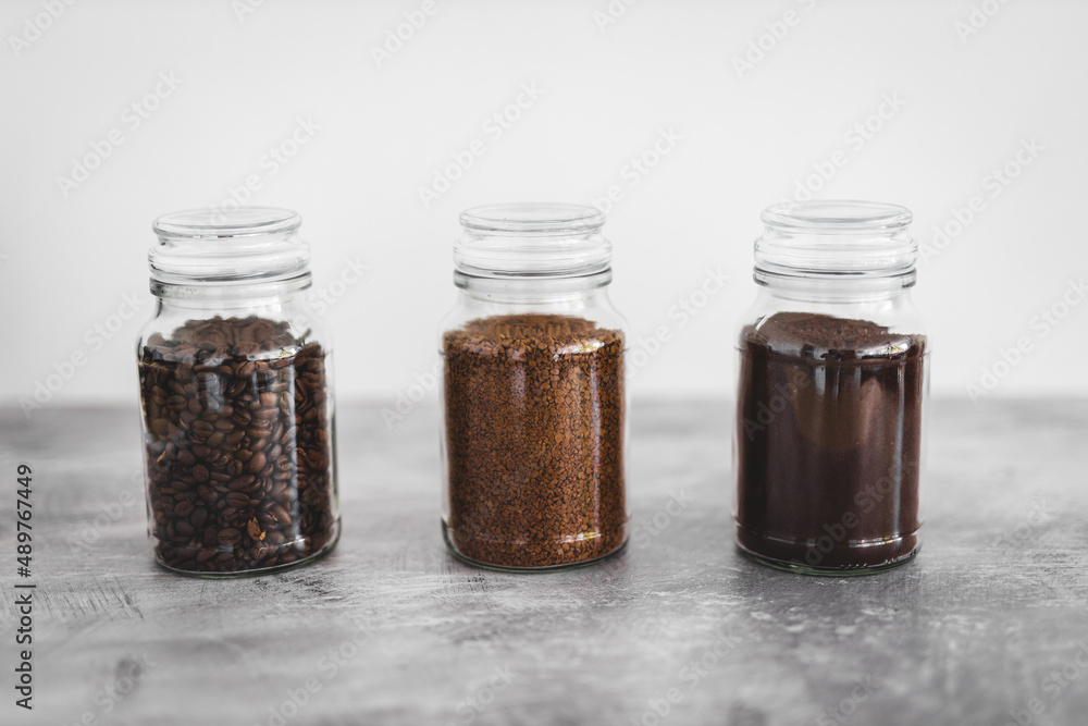 jars of coffee beans next to jar of instant coffee, best tasting option and coffee culture jars of coffee beans next to jar of instant coffee, best tasting option and coffee culture