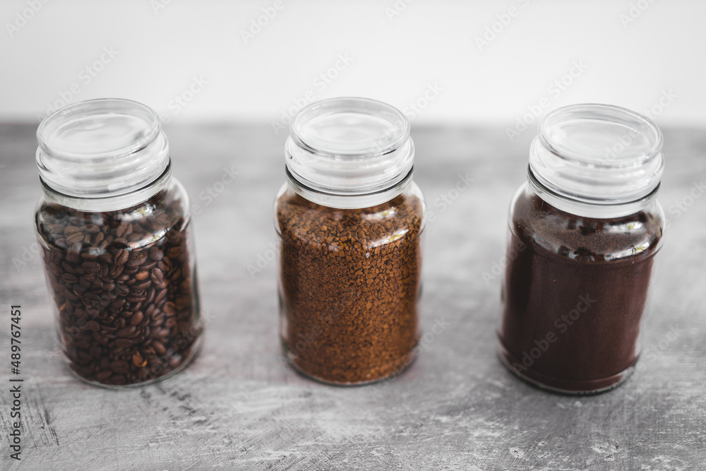 jars of coffee beans next to jar of instant coffee, best tasting option and coffee culture jars of coffee beans next to jar of instant coffee, best tasting option and coffee culture