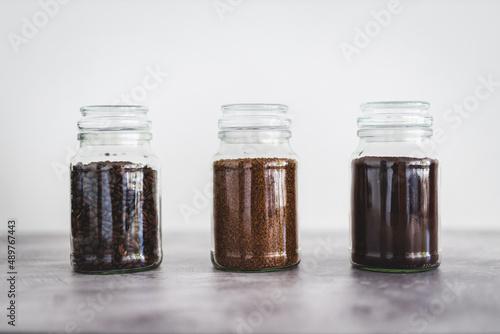 jars of coffee beans next to jar of instant coffee, best tasting option and coffee culture