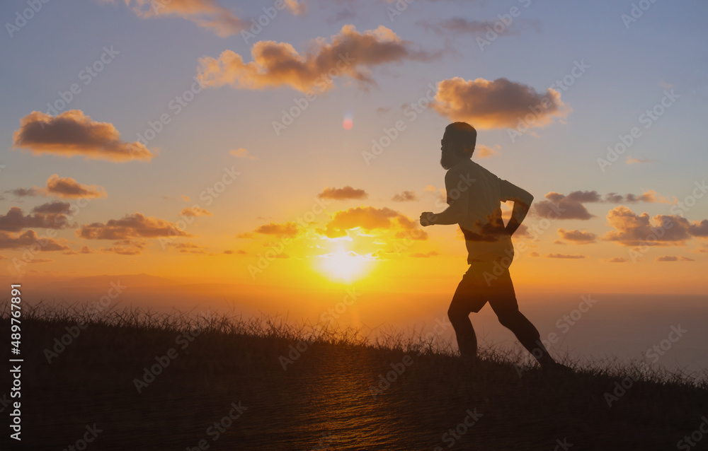 Man running exercising at sunrise 