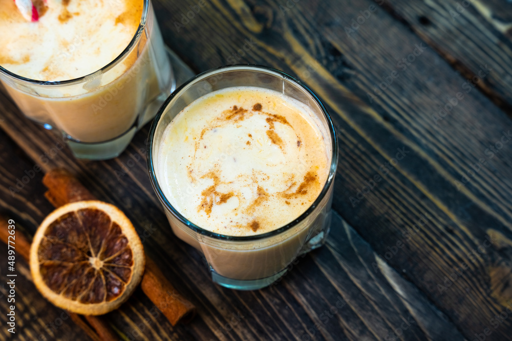 Yellow Indian mango yoghurt drink Mango Lassi or smoothie with turmeric and saffron. Yellow Indian mango yoghurt drink Mango Lassi or smoothie with turmeric and saffron.