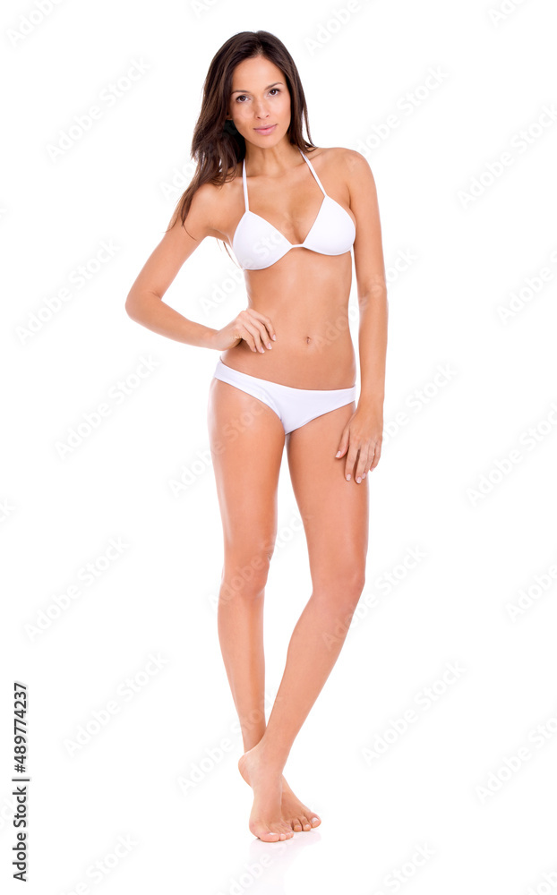 Shes sizzling hot this summer. Studio shot of a beautiful brunette model in a bikini isolated on white. Shes sizzling hot this summer. Studio shot of a beautiful brunette model in a bikini isolated on white.