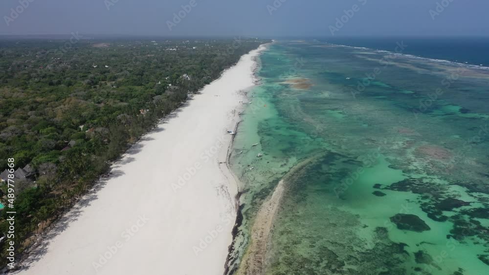 Diani beach Kenyan coast African Sea drone aerial 4k waves blue indan ocean tropical mombasa turquoise white sand East Africa palms paradise view Kenya landscape Diani beach Kenyan coast African Sea drone aerial 4k waves blue indan ocean tropical mombasa turquoise white sand East Africa palms paradise view Kenya landscape