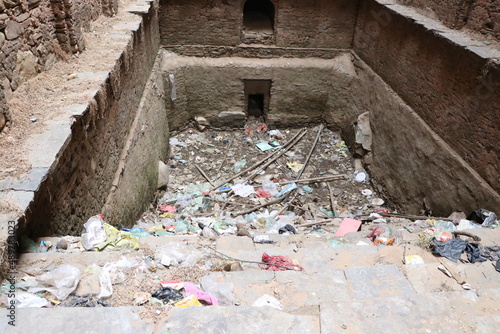 dry old water pond in plastic garbage.
