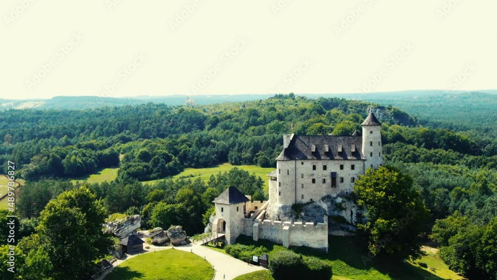 Bobolice medieval castle in a green land landscape aerial view. Poland Bobolice medieval castle in a green land landscape aerial view. Poland