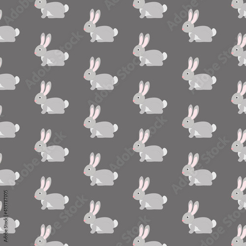 Cute rabbit seamlrss pattern. Vector illustration. Textile desig, wrapping paper, wallpaper design. Scrapbooking. Gray bunny, hare animal. Gray background.