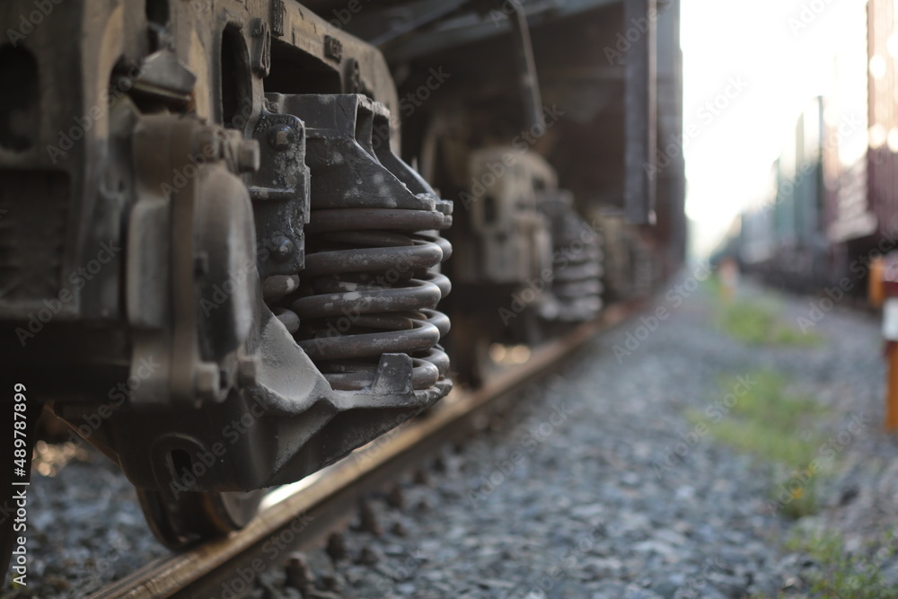 Freight train wagon carriage. Locomotive, train in motion, metal wheels background. Railway transportation system. Logistic service, Industrial transporting