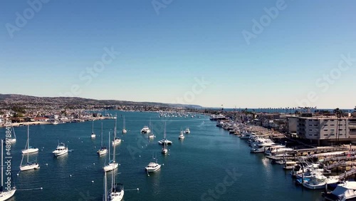 Drone Video up to 100ft of Newport Harbor looking South in a rising video which includes the Southern California Coast