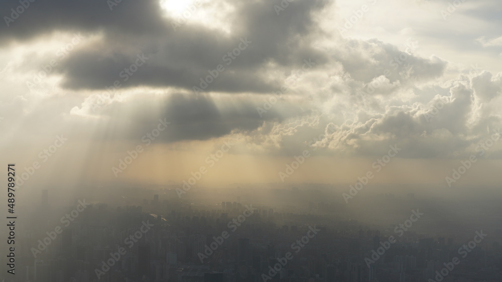 The beautiful city overlook view from the top of one skyscraper with the cloudy sky The beautiful city overlook view from the top of one skyscraper with the cloudy sky