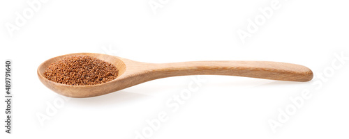 Brown Teff Grain in wood spoon on white photo