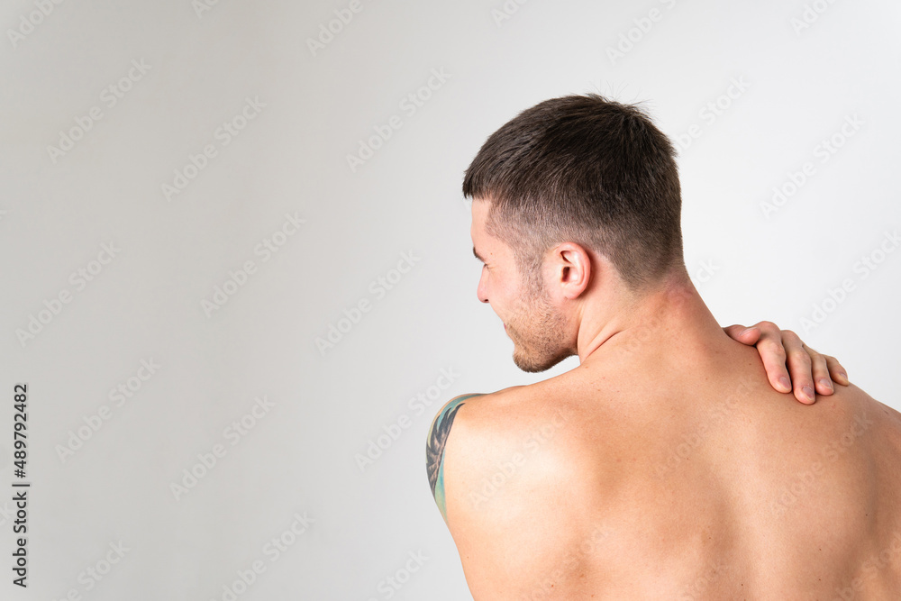 The muscles of the neck in a man on a white background are hurt painful, backache sick male health medical, muscular chronic. Tension lumbar lower suffer attractive The muscles of the neck in a man on a white background are hurt painful, backache sick male health medical, muscular chronic. Tension lumbar lower suffer attractive