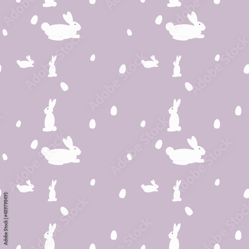 Vector seamless pattern of rabbits and Easter eggs.