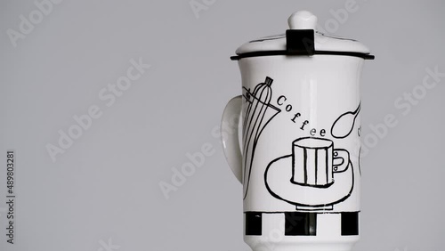 Coffee mug spinning on the right side of the screen - copy space stock video photo