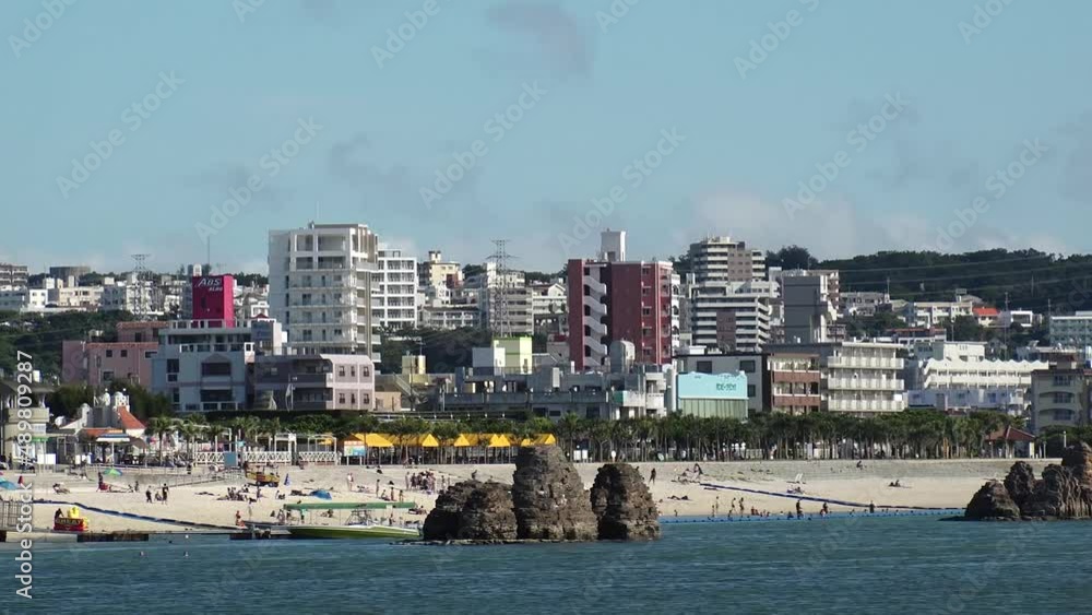 CHTAN-CHO, OKINAWA, JAPAN - AUGUST 2021 : View of Araha beach (Ocean or sea). Wide view, time lapse shot in daytime. Summer holiday, vacation and resort concept video. CHTAN-CHO, OKINAWA, JAPAN - AUGUST 2021 : View of Araha beach (Ocean or sea). Wide view, time lapse shot in daytime. Summer holiday, vacation and resort concept video.