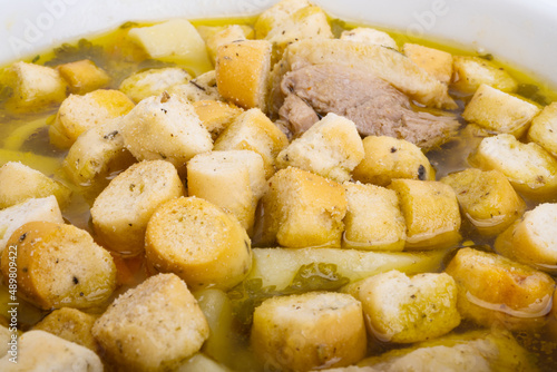 chicken broth with croutons isolated