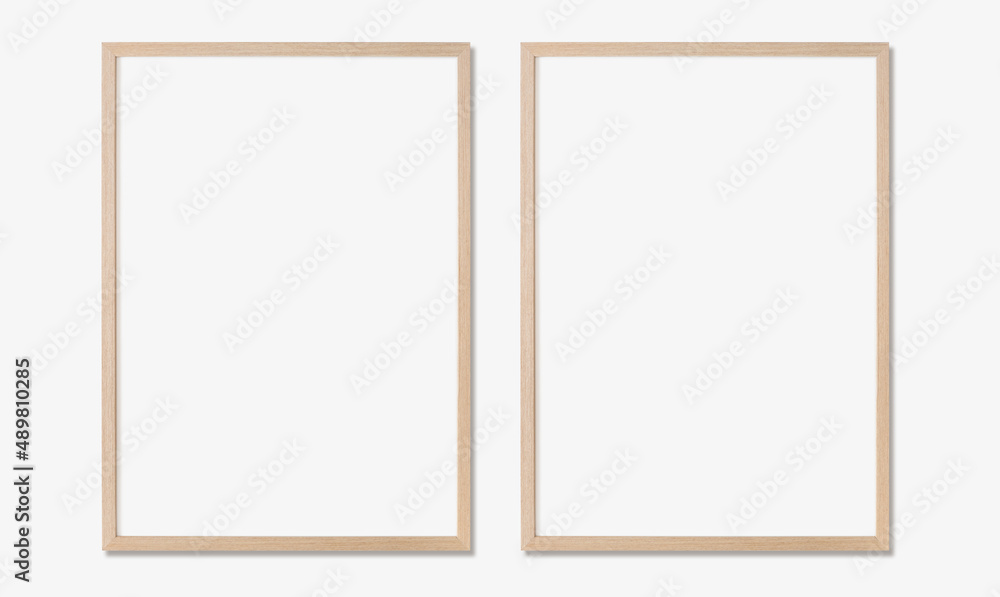 Picture frame mockup, Set of two vertical oak wooden frames on white wall, Template for artwork, painting or poster Picture frame mockup, Set of two vertical oak wooden frames on white wall, Template for artwork, painting or poster