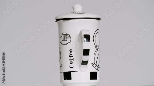 Coffee mug turning on the turntable - stock video photo