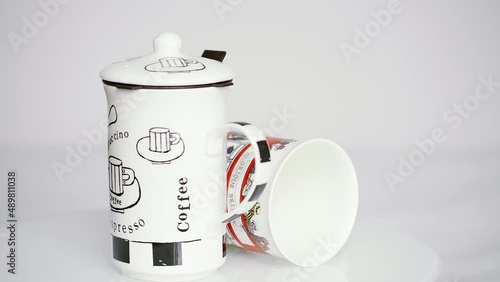 Coffee and tea mug turning on the turntable - stock video. photo