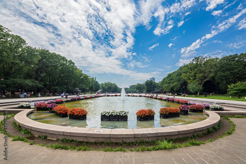 Japan, Kanto Region, Tokyo, Ueno Park pond and fountain in summer