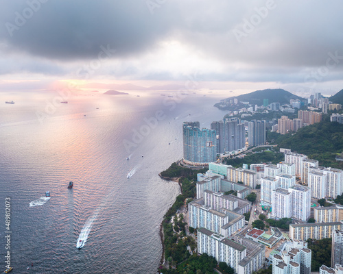 amazing drone shot of sunset in Aberdeen, Hong Kong. Famous tourist location and combining old and residential area. photo