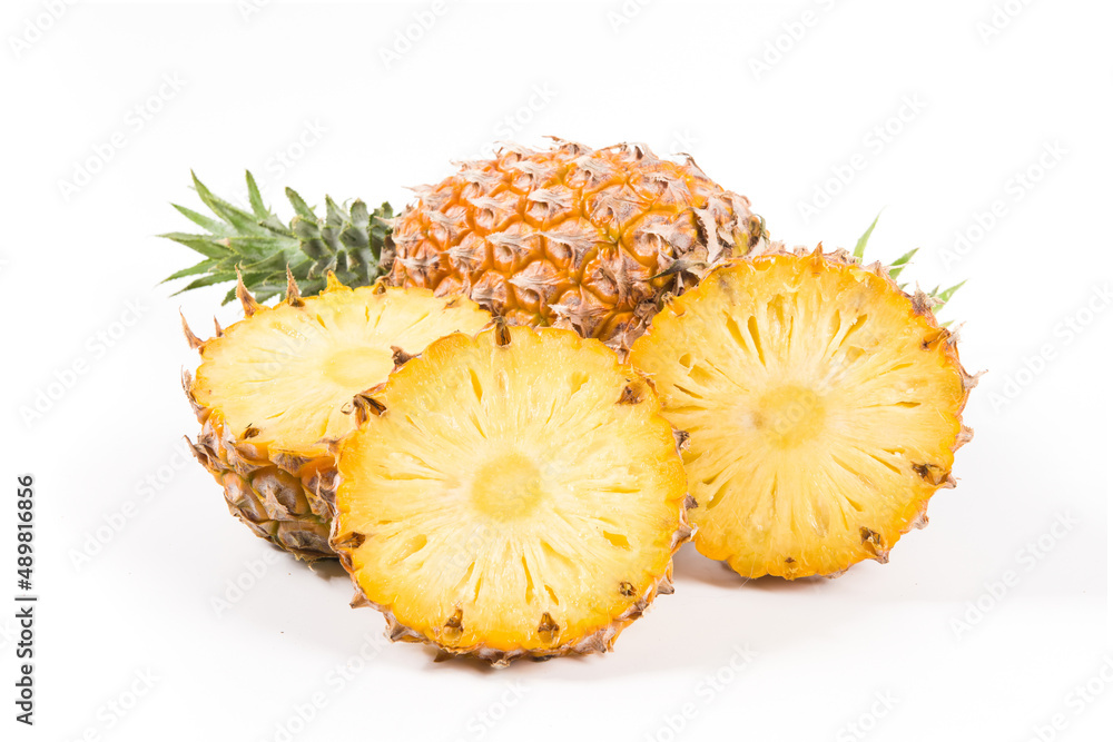 Sliced and whole of pineapple (Ananas comosus) isolated on white background Sliced and whole of pineapple (Ananas comosus) isolated on white background