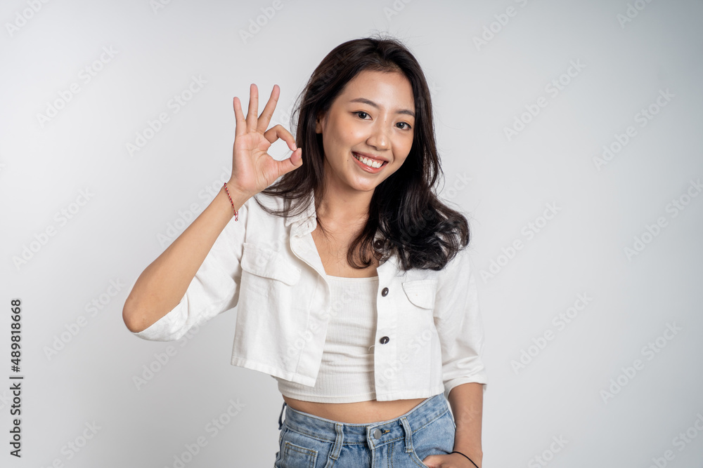 beautiful Young asian woman smiling with okay hand gesture beautiful Young asian woman smiling with okay hand gesture