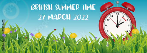 British summer time change in 2022 with English text, illustration banner with spring flowers and clock changing