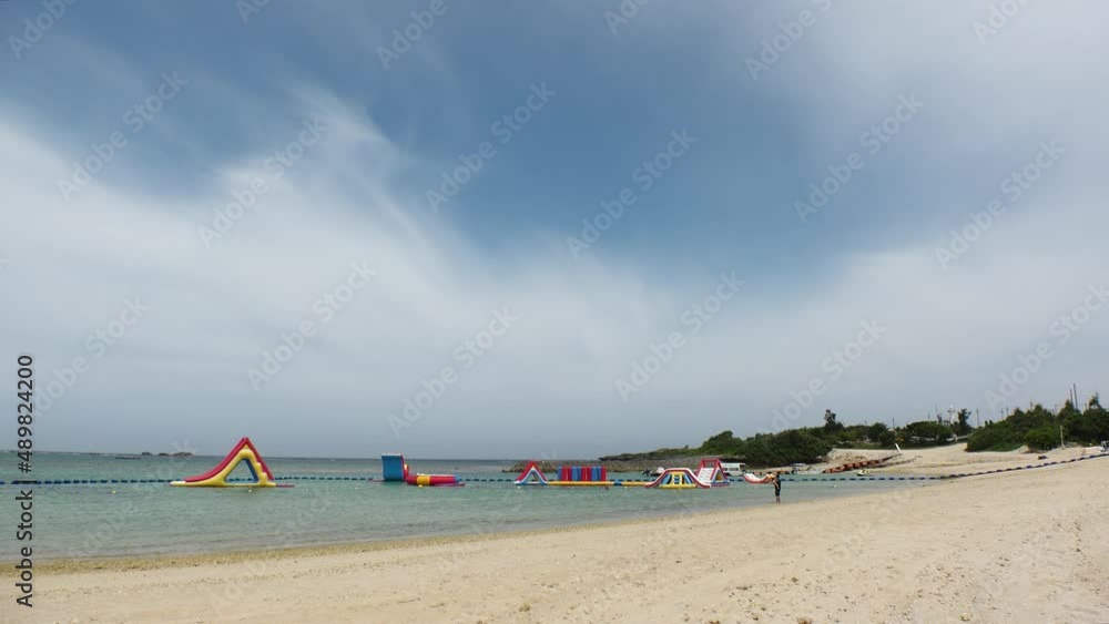 YOMITANSON, OKINAWA, JAPAN - AUGUST 2021 : View of Zanpa beach (Ocean or sea) in sunny daytime. Summer holiday, vacation and resort concept video. YOMITANSON, OKINAWA, JAPAN - AUGUST 2021 : View of Zanpa beach (Ocean or sea) in sunny daytime. Summer holiday, vacation and resort concept video.