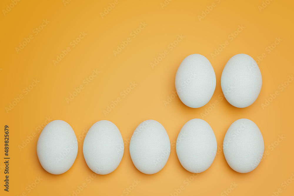 Seven white chicken eggs on yellow background top view. Creative food minimalistic background. Seven white chicken eggs on yellow background top view. Creative food minimalistic background.