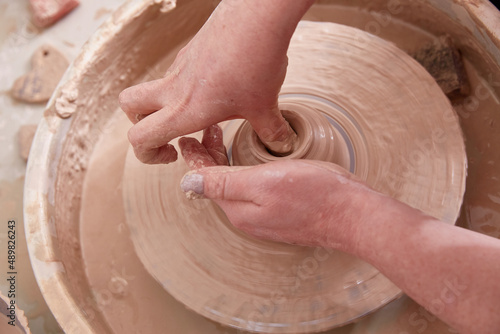 Pottery wheel dot female hand sculpt bowl