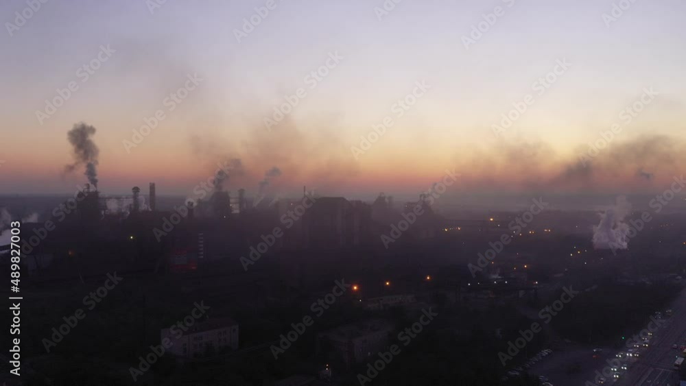 Dust and smoke of a steel mill. Environmental pollution. Steel plant at dawn. Aerial view. Mariupol Ukraine Dust and smoke of a steel mill. Environmental pollution. Steel plant at dawn. Aerial view. Mariupol Ukraine