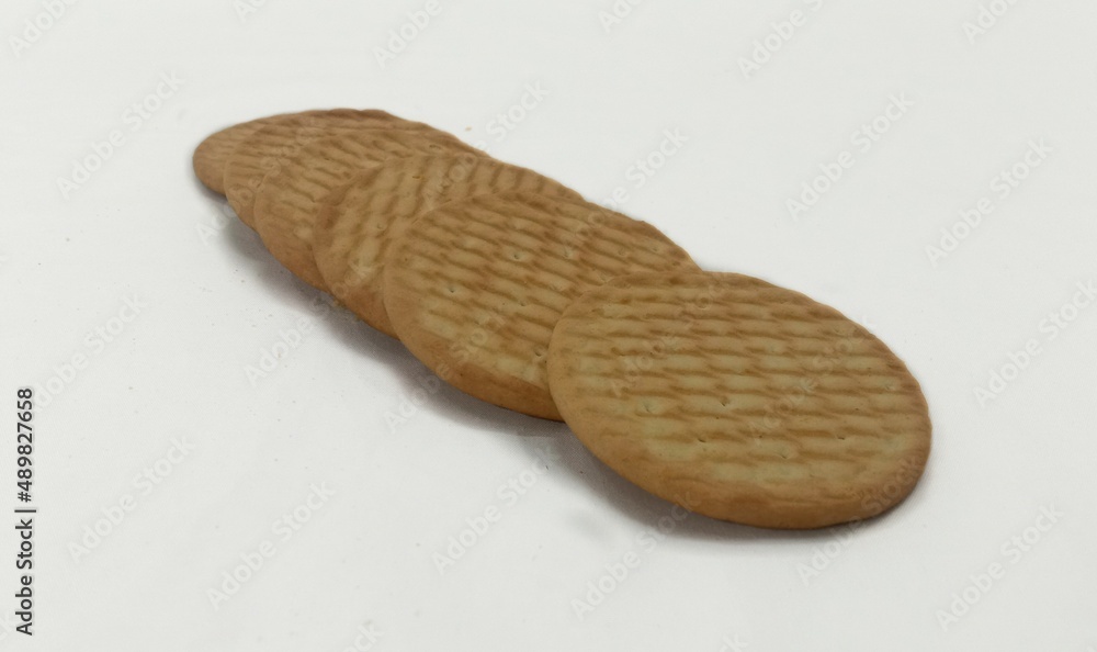 Brown Biscuits In A Line On White Background Brown Biscuits In A Line On White Background