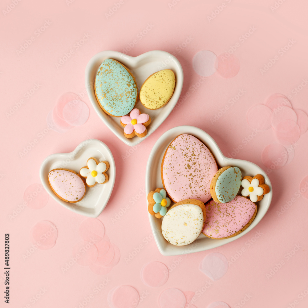 Colorful easter cookies with icing on pink background, colorful seasonal holiday concept, stylish greeting card, invitation, flyer. Delicious traditional cookies for kids, copy space, banner Colorful easter cookies with icing on pink background, colorful seasonal holiday concept, stylish greeting card, invitation, flyer. Delicious traditional cookies for kids, copy space, banner