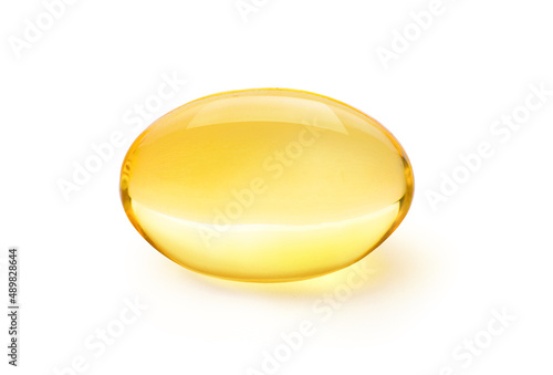 Tableau sur toile Golden color oil in soft gel capsule isolated on white background