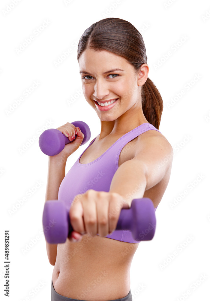 Exercising makes me happy. Studio portrait of a beautiful young woman lifting dumbbells. Exercising makes me happy. Studio portrait of a beautiful young woman lifting dumbbells.
