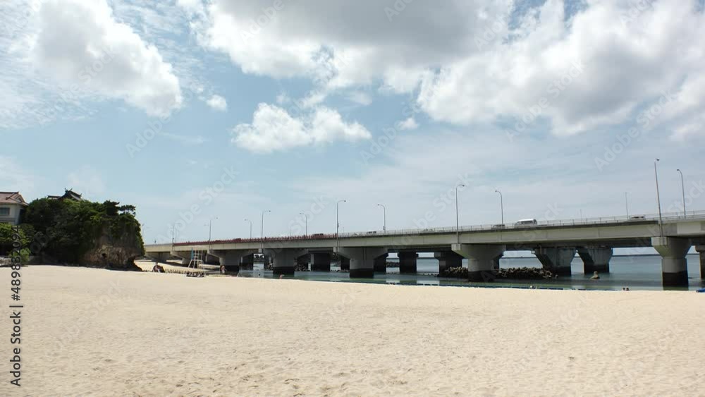 NAHA, OKINAWA, JAPAN - AUGUST 2021 : View of Naminoue beach (Ocean or sea) in daytime. Clear sunny sky and clouds. Wide view, real time shot. Summer holiday, vacation and resort concept video. NAHA, OKINAWA, JAPAN - AUGUST 2021 : View of Naminoue beach (Ocean or sea) in daytime. Clear sunny sky and clouds. Wide view, real time shot. Summer holiday, vacation and resort concept video.