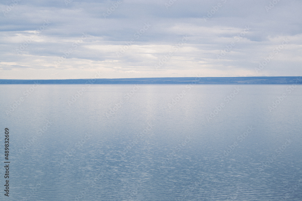 Landscape of the river Volga. Shore on the opposite side. Spacious river at autumn