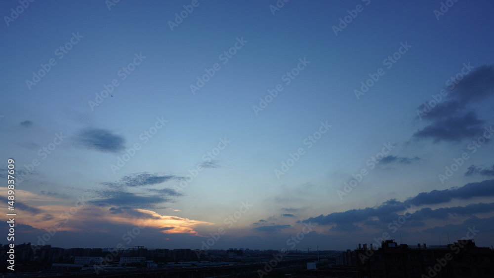 The beautiful sunset view with the colorful clouds and sky in the city The beautiful sunset view with the colorful clouds and sky in the city
