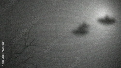 UFO - Unidentified flying objects, flying saucers in the sky. Concept of archival bluured footage on an old vintage camera.  A place for the title.