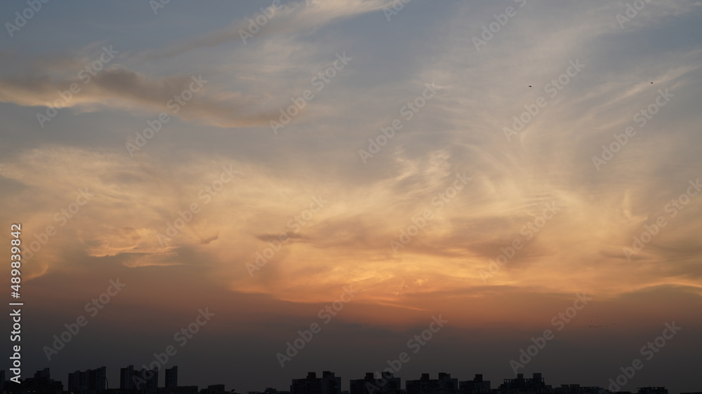 The beautiful sunset view with the colorful clouds and sky in the city