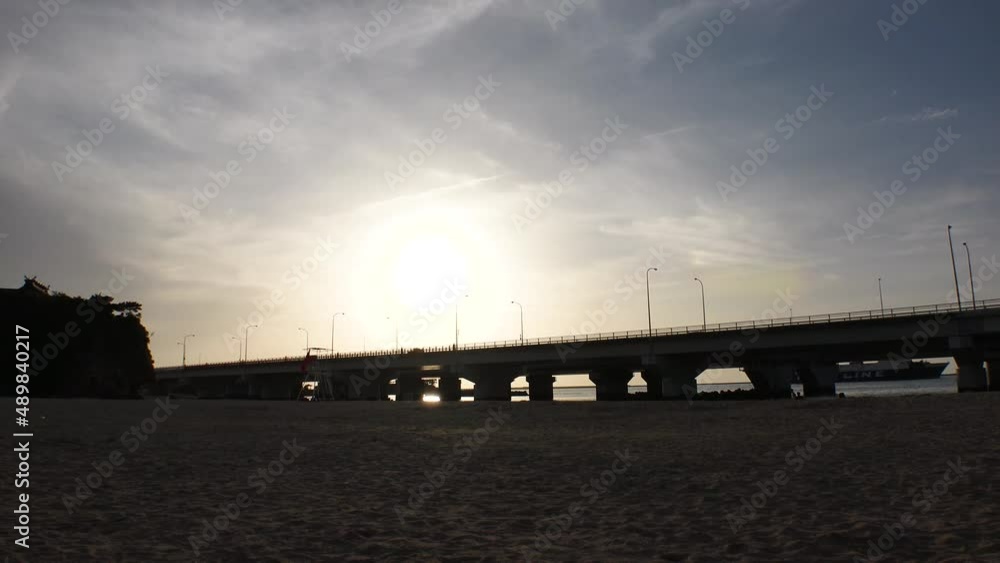 NAHA, OKINAWA, JAPAN - AUGUST 2021 : View of Naminoue beach (Ocean or sea) in dusk. Sunset sky and clouds. Wide view, real time shot. Summer holiday, vacation and resort concept video. NAHA, OKINAWA, JAPAN - AUGUST 2021 : View of Naminoue beach (Ocean or sea) in dusk. Sunset sky and clouds. Wide view, real time shot. Summer holiday, vacation and resort concept video.