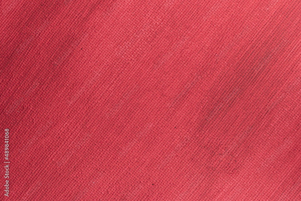 Fototapeta premium Abstract hand painted red canvas background texture.