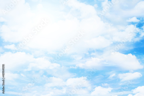 Heaven background. Cloudy sky background. Fluffy clouds on the sky background. Cloudscape view. Bright sunlight on the sky. Middle of the day high sun.