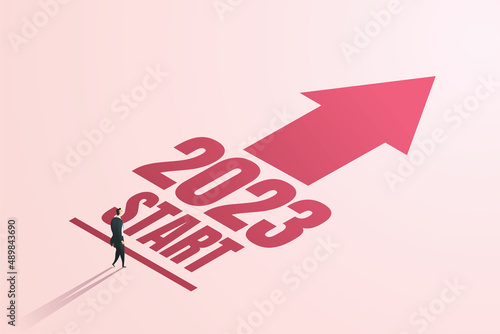 Businessman ready in starting position towards goals