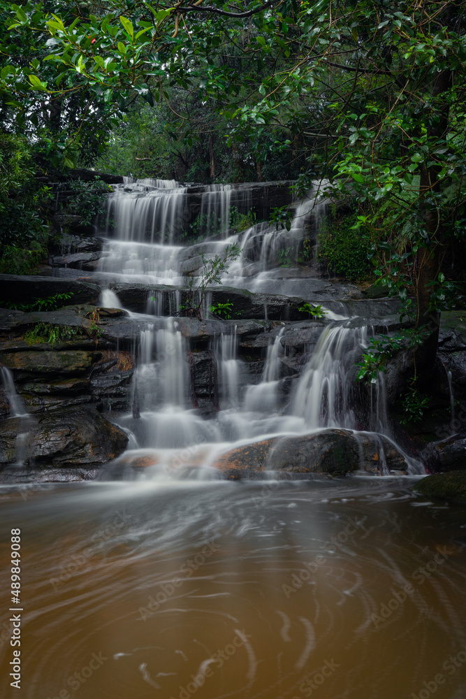 A small waterfall cascade in the rainforest. A small waterfall cascade in the rainforest.