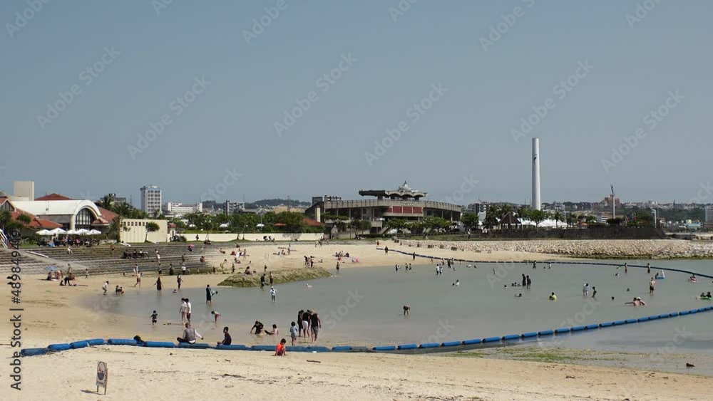 CHATAN-CHO, OKINAWA, JAPAN - AUGUST 2021 : View of Chatan sunset beach (Ocean or sea). Wide view, time lapse shot in daytime. Summer holiday, vacation and resort concept video. CHATAN-CHO, OKINAWA, JAPAN - AUGUST 2021 : View of Chatan sunset beach (Ocean or sea). Wide view, time lapse shot in daytime. Summer holiday, vacation and resort concept video.