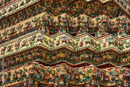 Golden Pattern at Wat Pho in Bangkok  Thailand with Floral Design of shapes and color. Vintage thai golden pattern with gems. Asian golden ornament in Thailand. Traditional decorative background