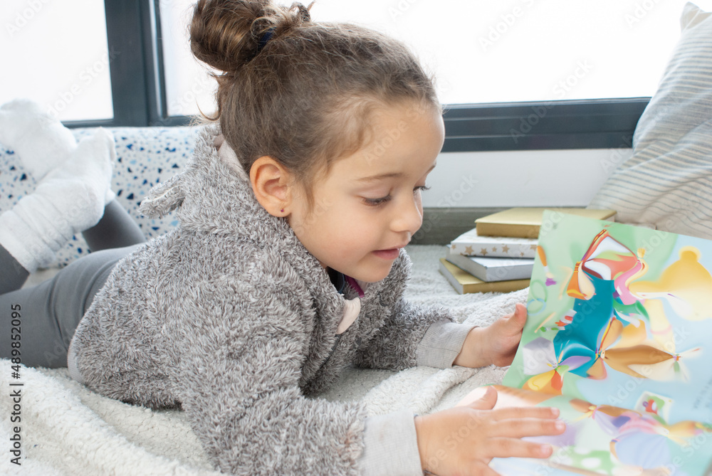 LITTLE GIRL READING A STORY LITTLE GIRL READING A STORY