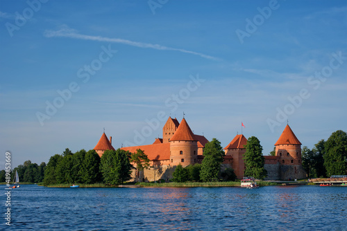 Trakai Island Castle in lake Galve with boats and yachts in summer day with beautiful sky, Lithuania. Trakai Castle is one of major tourist attractions of Lithuania