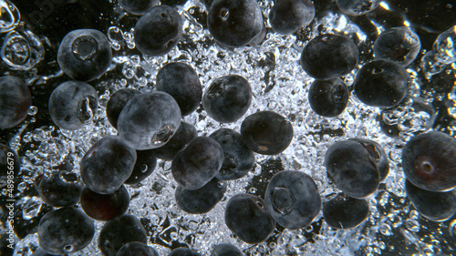 Fresh blueberries falling i...